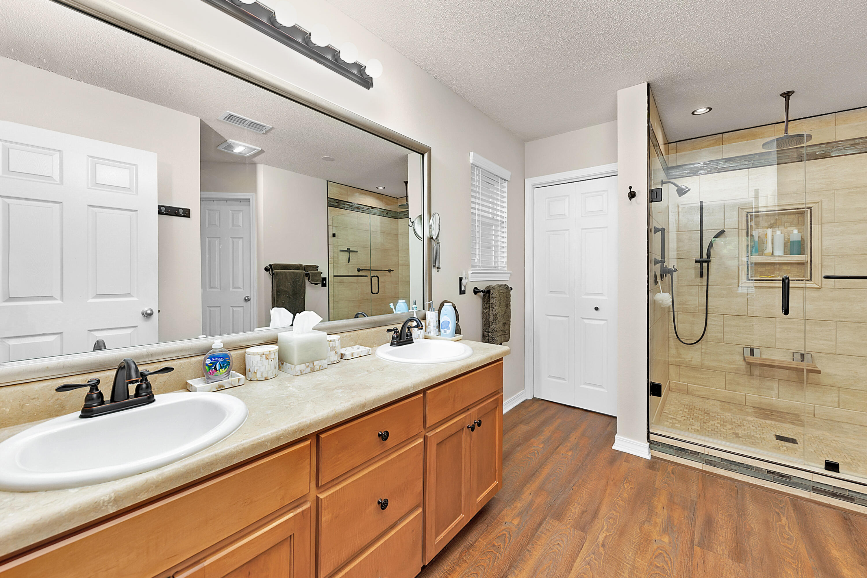 2389 Genevieve Way Crestview, FL 32536 - Photo 31 of 44 a bathroom with a double vanity sink mirror double and shower