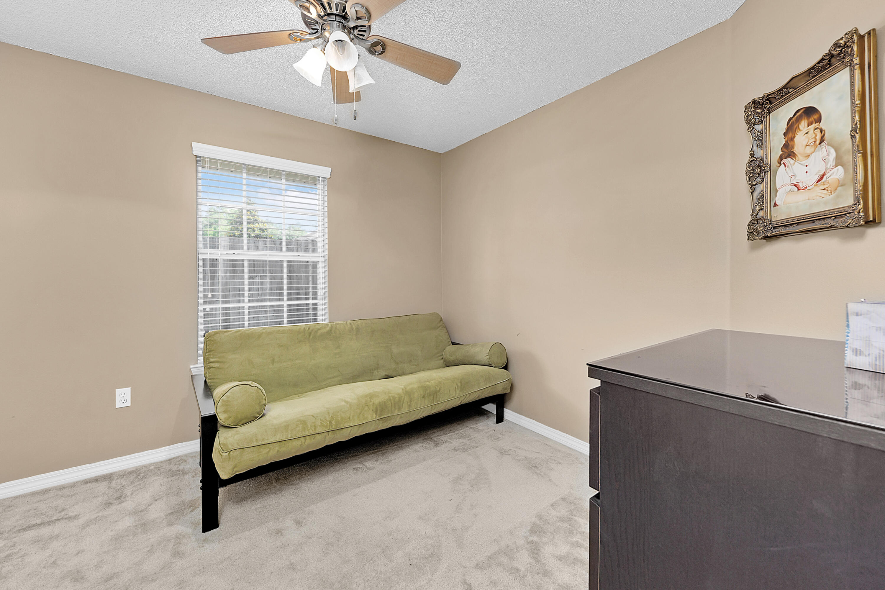2389 Genevieve Way Crestview, FL 32536 - Photo 32 of 44 a living room with furniture and a window