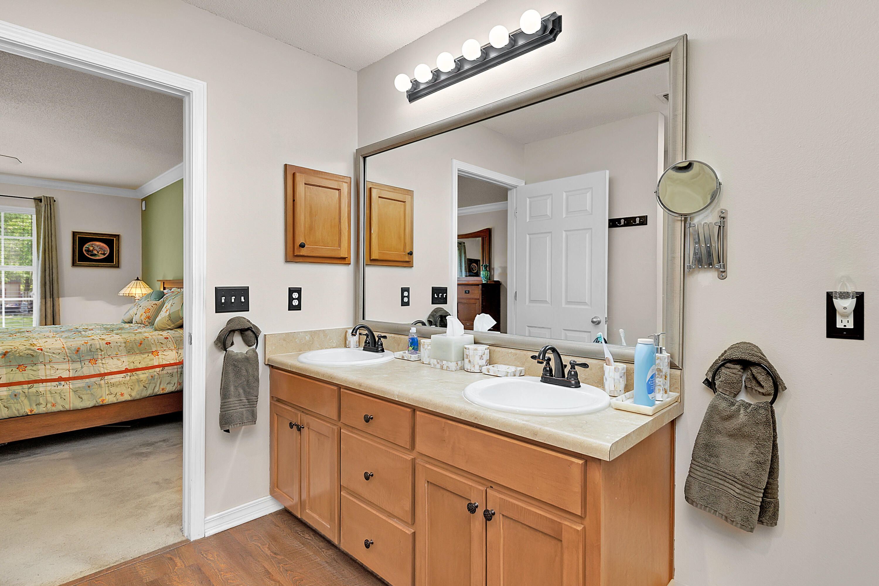 2389 Genevieve Way Crestview, FL 32536 - Photo 38 of 44 a en suite bathroom with a double vanity sink and a mirror