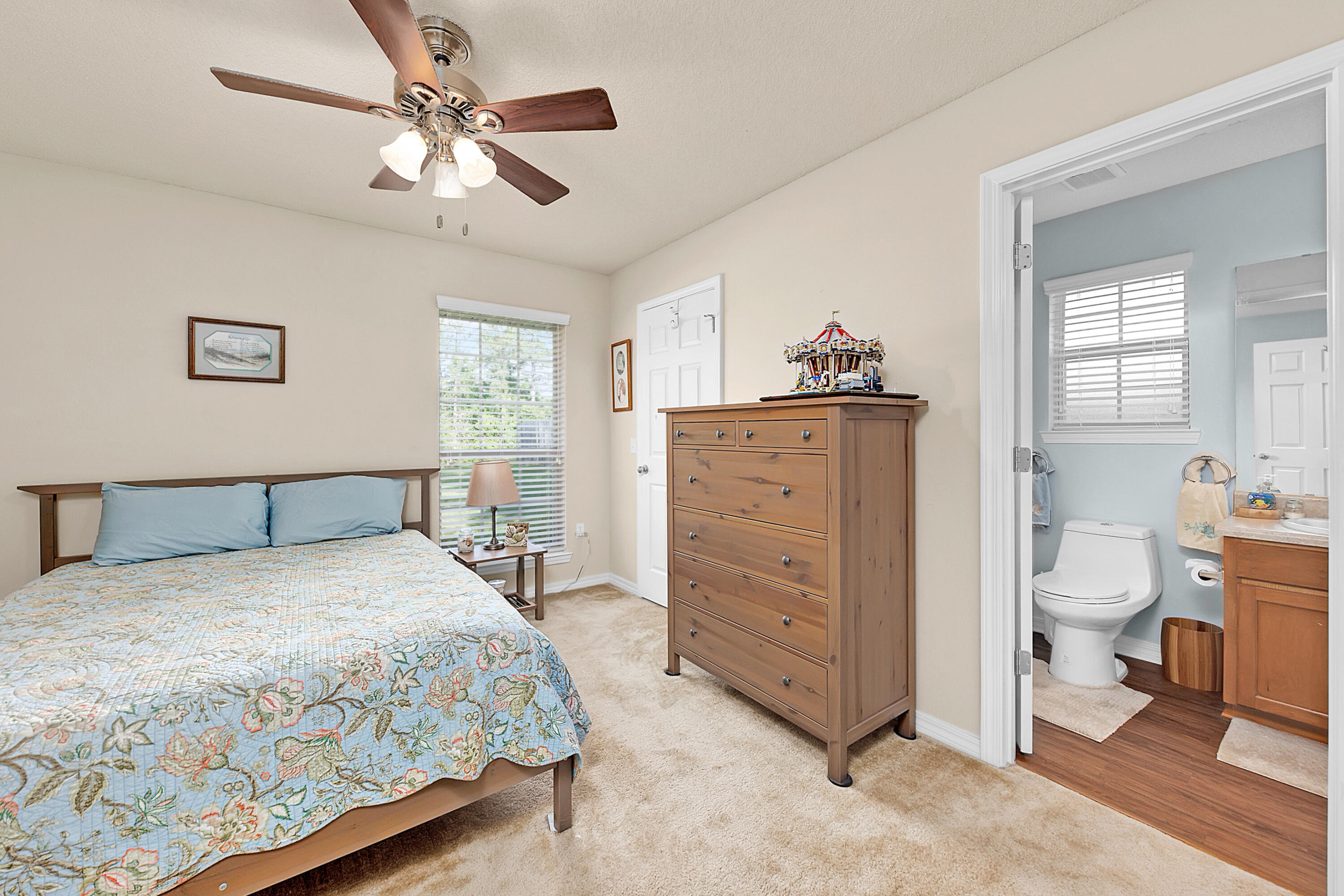 2389 Genevieve Way Crestview, FL 32536 - Photo 40 of 44 a bedroom with a bed and a dresser