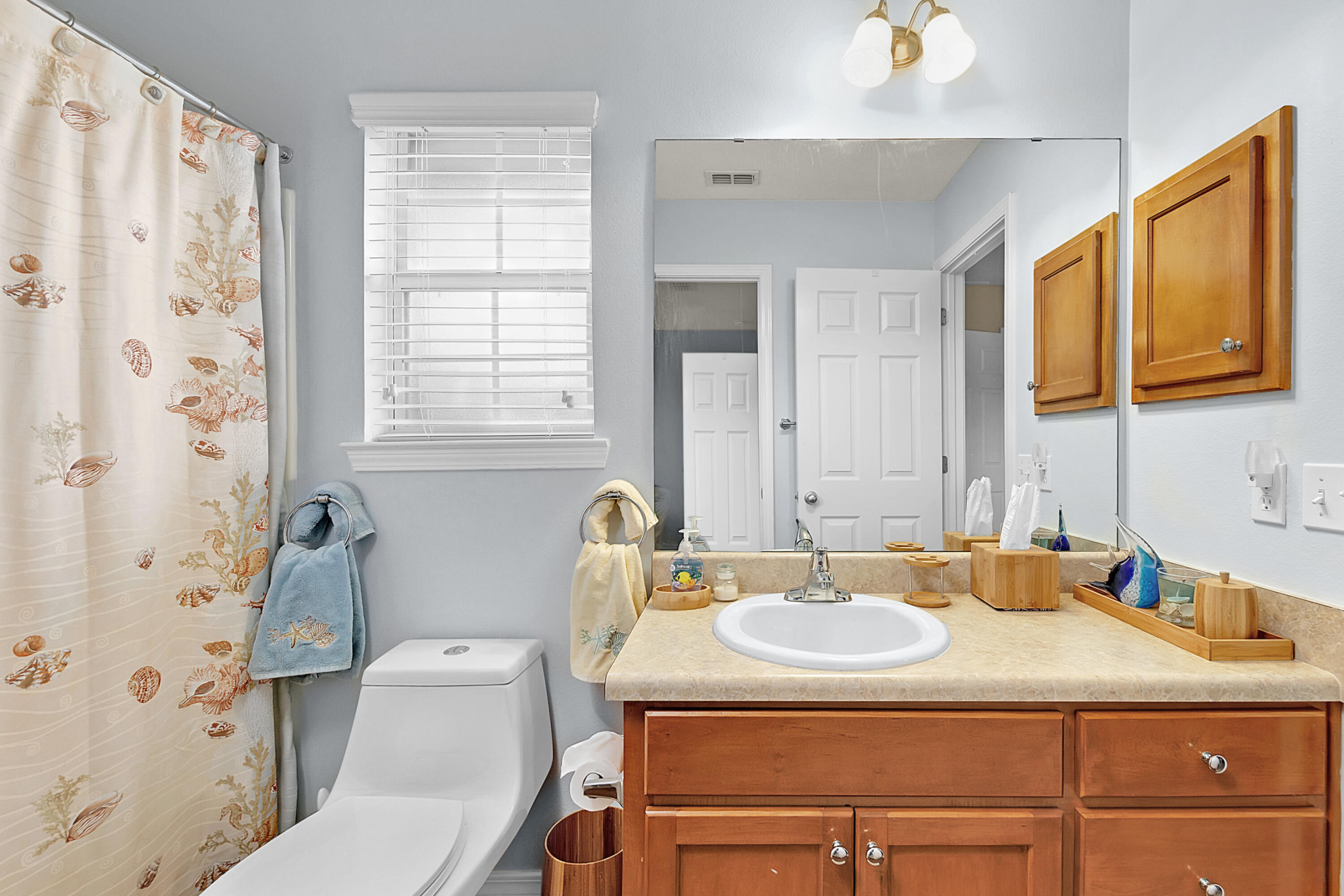 2389 Genevieve Way Crestview, FL 32536 - Photo 43 of 44 a bathroom with a sink toilet and shower