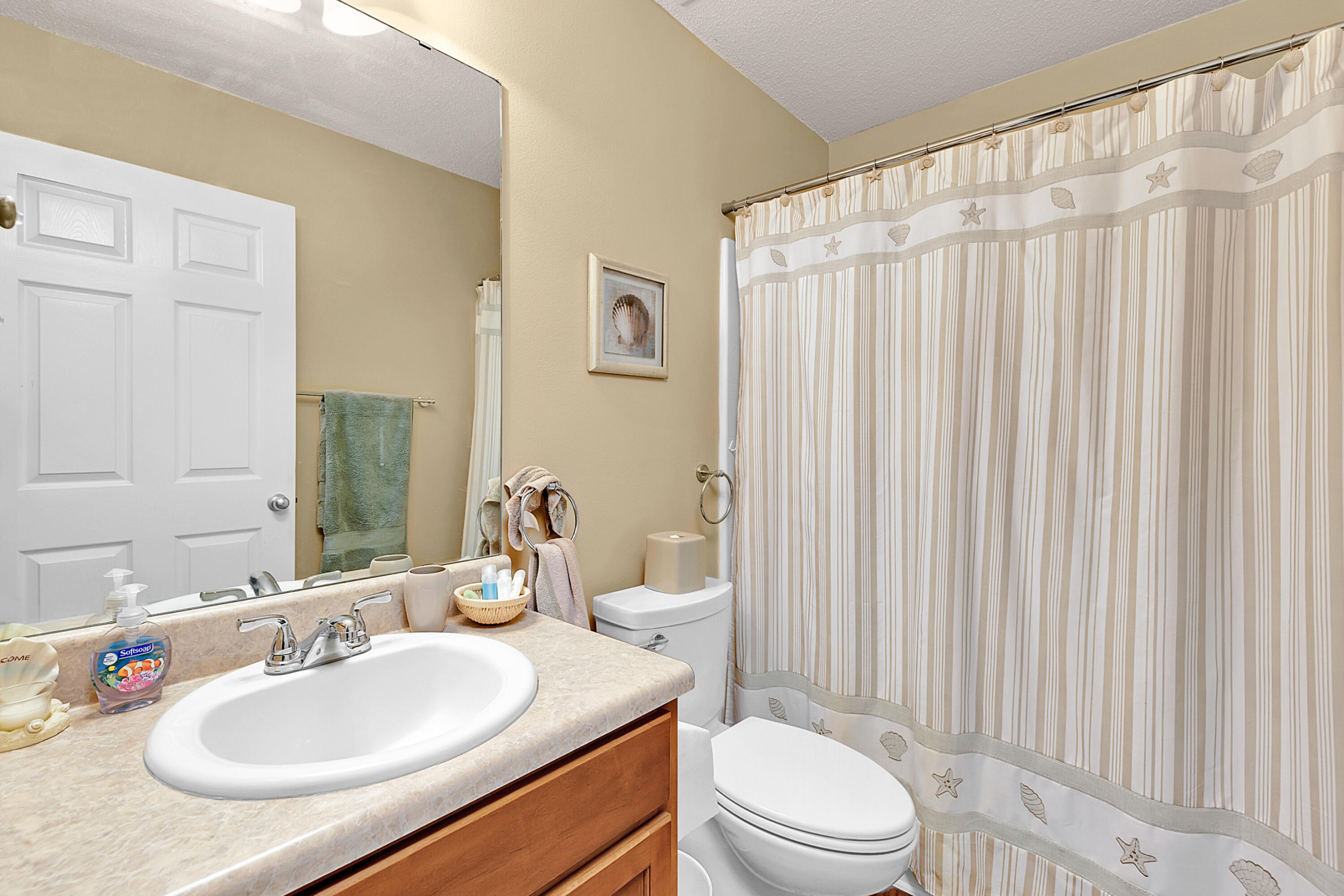 2389 Genevieve Way Crestview, FL 32536 - Photo 44 of 44 a bathroom with a sink toilet and shower