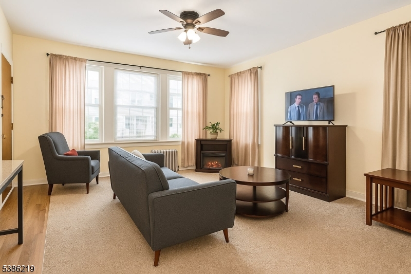 26 Harding Terrace, Unit 1 Newark, NJ 07112 - Photo 2 of 12 a living room with furniture and a window