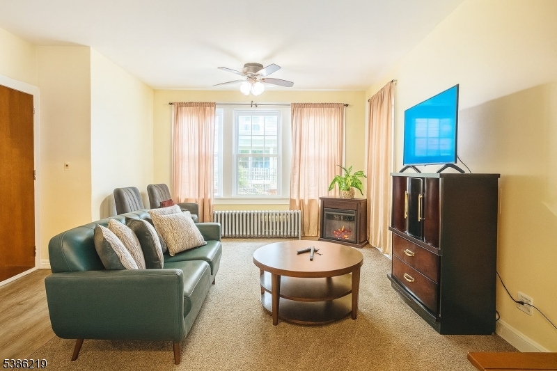 26 Harding Terrace, Unit 1 Newark, NJ 07112 - Photo 3 of 12 a living room with furniture and a large window