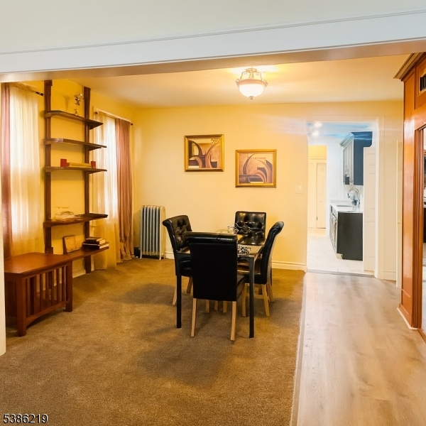 26 Harding Terrace, Unit 1 Newark, NJ 07112 - Photo 4 of 12 a view of a dining room with furniture and a table