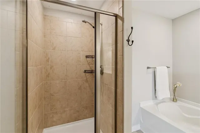 a bathroom with a shower and a sink