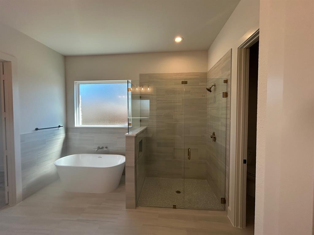 415 East Burks Street Pilot Point, TX 76258 - Photo 10 of 13 a bathroom with a shower and a sink