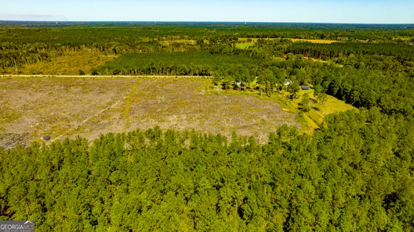 a view of a field with an outdoor space