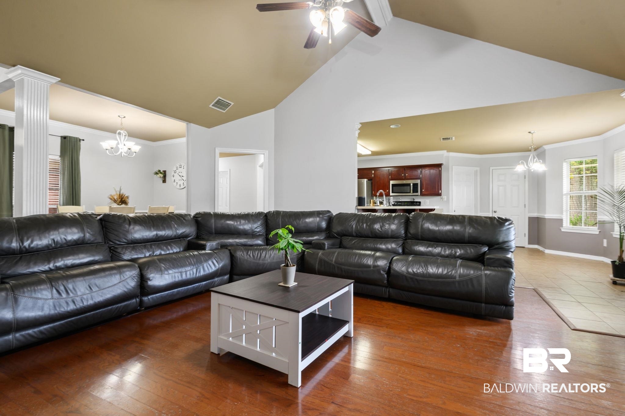 9422 Labrador Run South Mobile, AL 36695 - Photo 9 of 36 Spacious living area featuring wood-finish flooring, a vaulted ceiling, and recessed lighting
