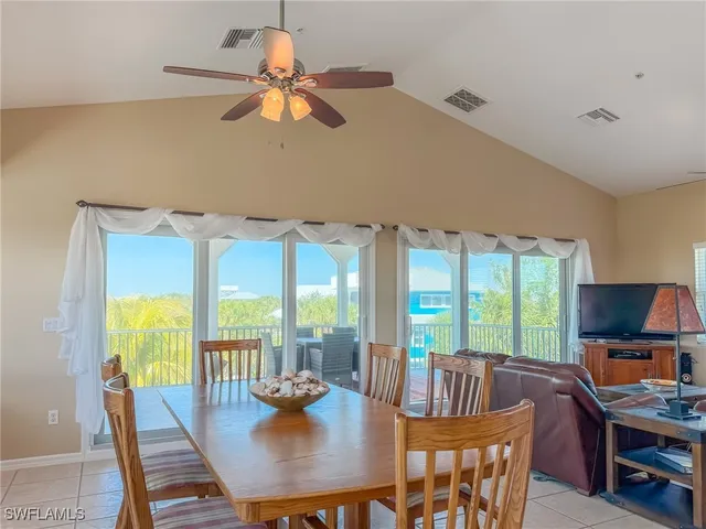 a room with patio furniture and a large window