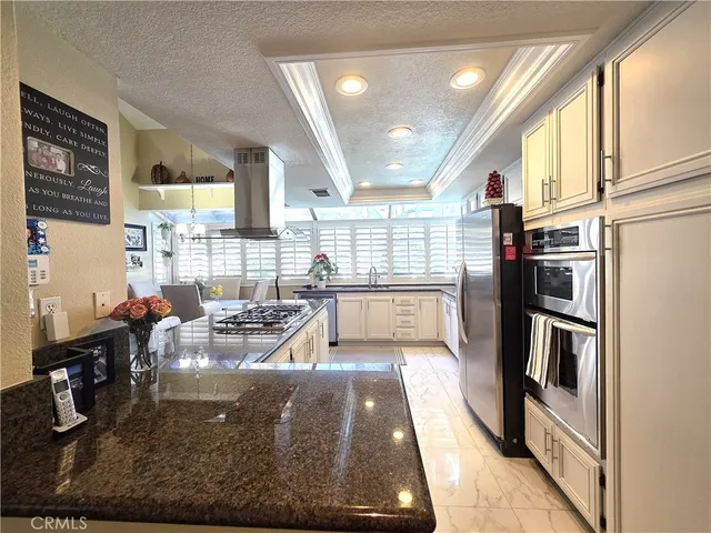 a view of a living room and kitchen view
