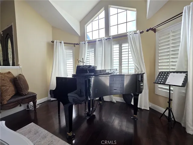 a view of a livingroom with furniture and a window