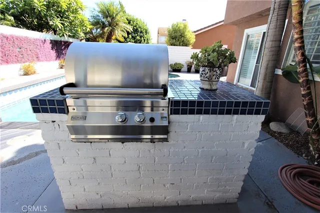 a view of a street with potted plants