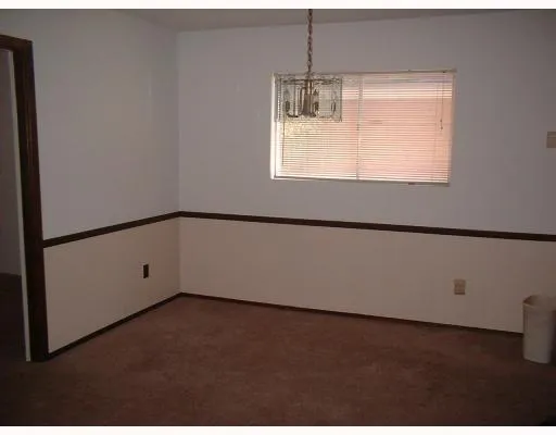 a view of a big room with windows