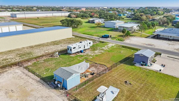 an aerial view of a house with a swimming pool