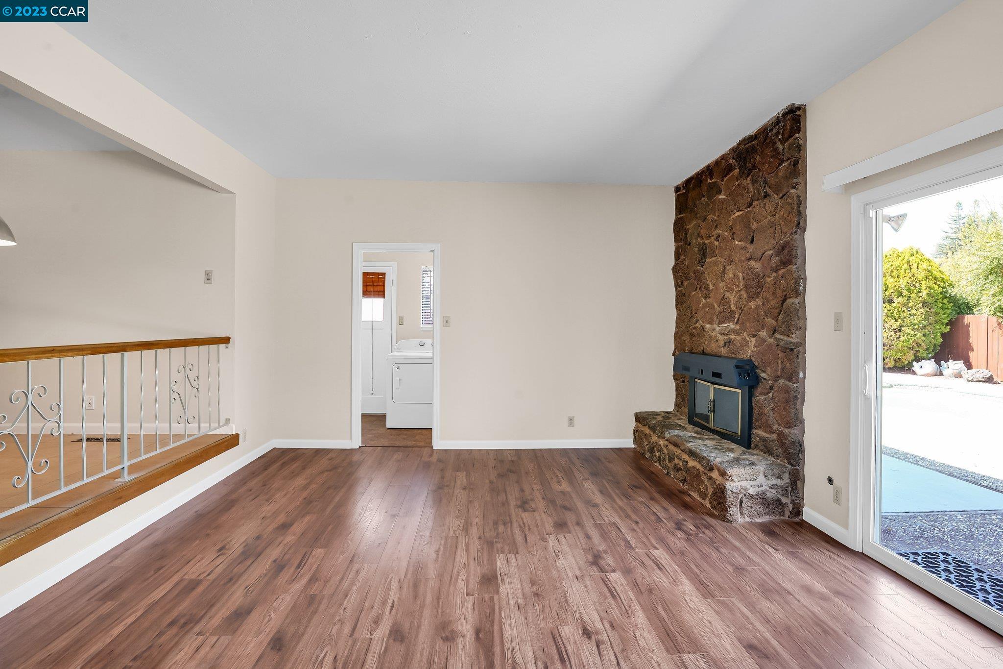 348 Barrett Circle Danville, CA 94526 - Photo 11 of 41 a view of empty room with wooden floor and fireplace