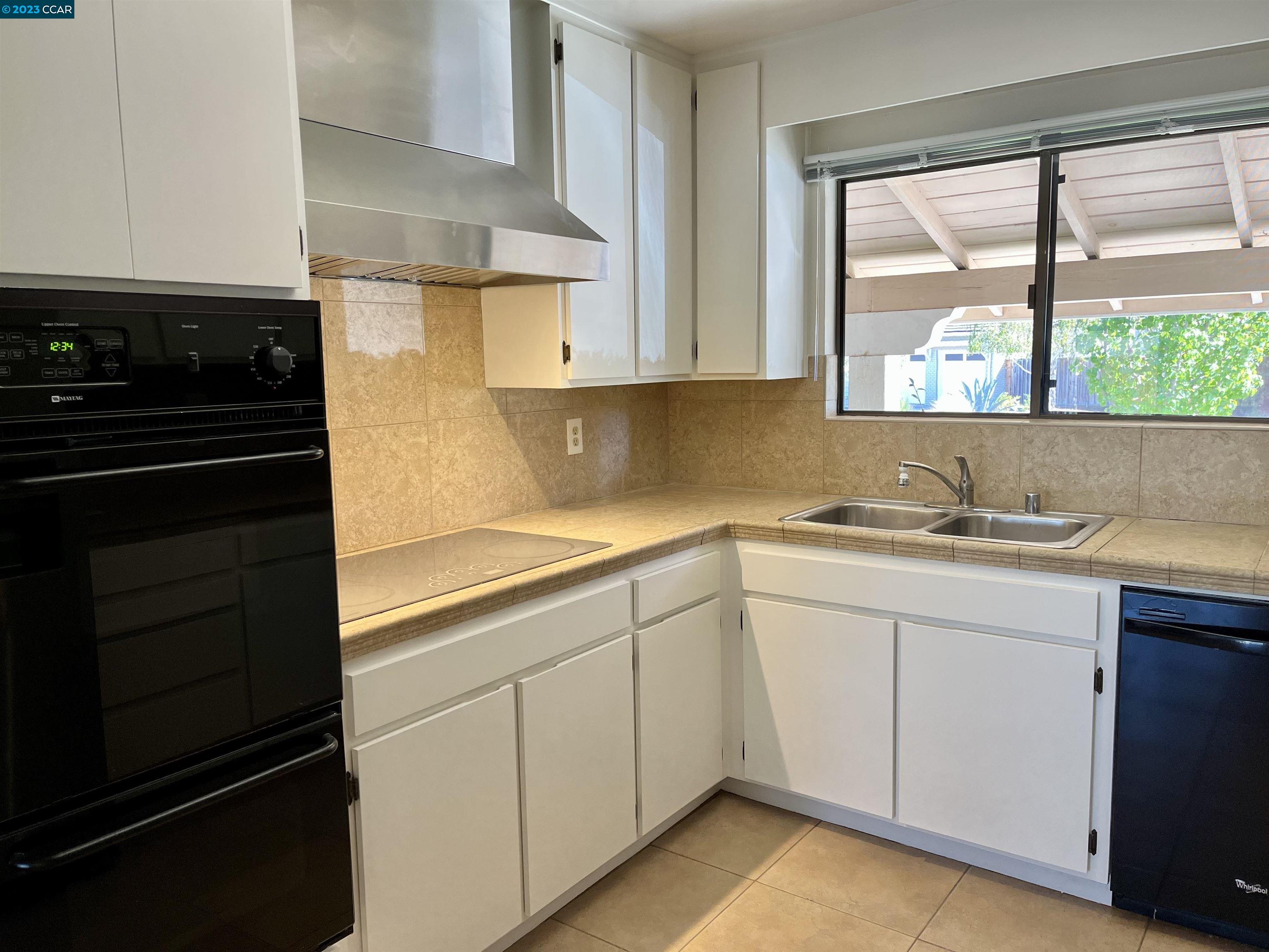 348 Barrett Circle Danville, CA 94526 - Photo 15 of 41 a kitchen with a sink stove and cabinets