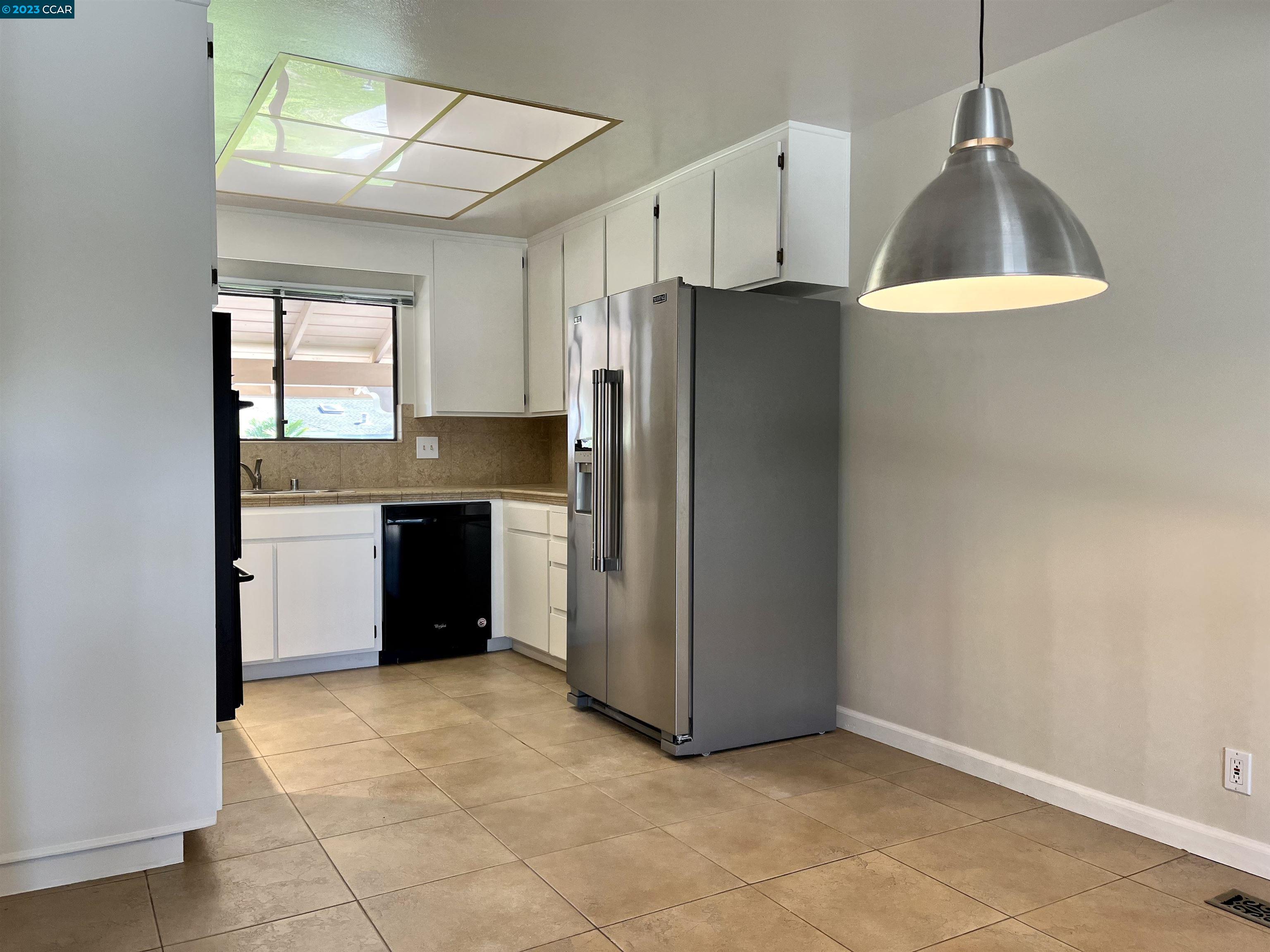 348 Barrett Circle Danville, CA 94526 - Photo 20 of 41 a kitchen with a cabinets and a refrigerator