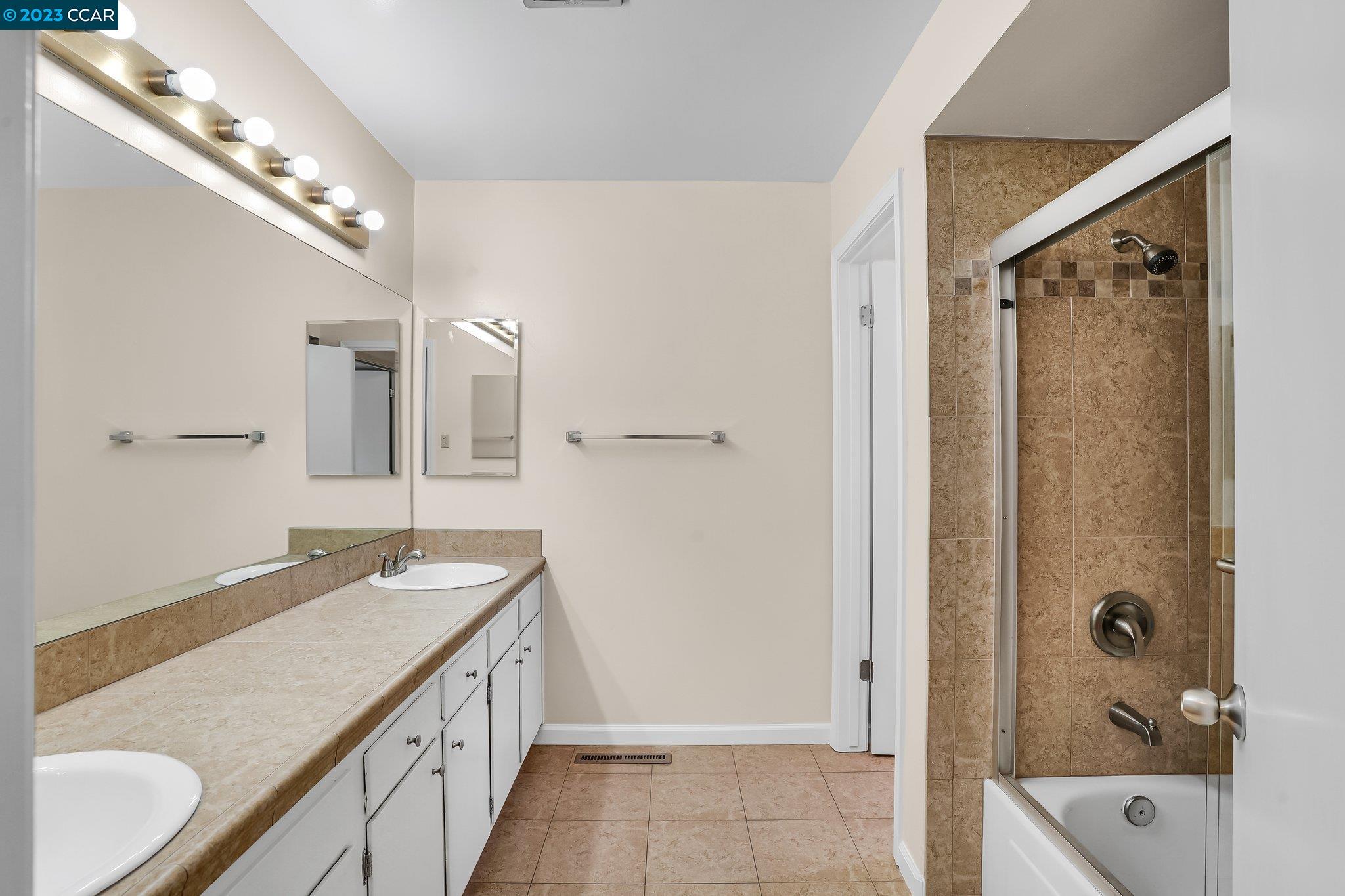 348 Barrett Circle Danville, CA 94526 - Photo 22 of 41 a bathroom with a granite countertop double vanity sink mirror and shower