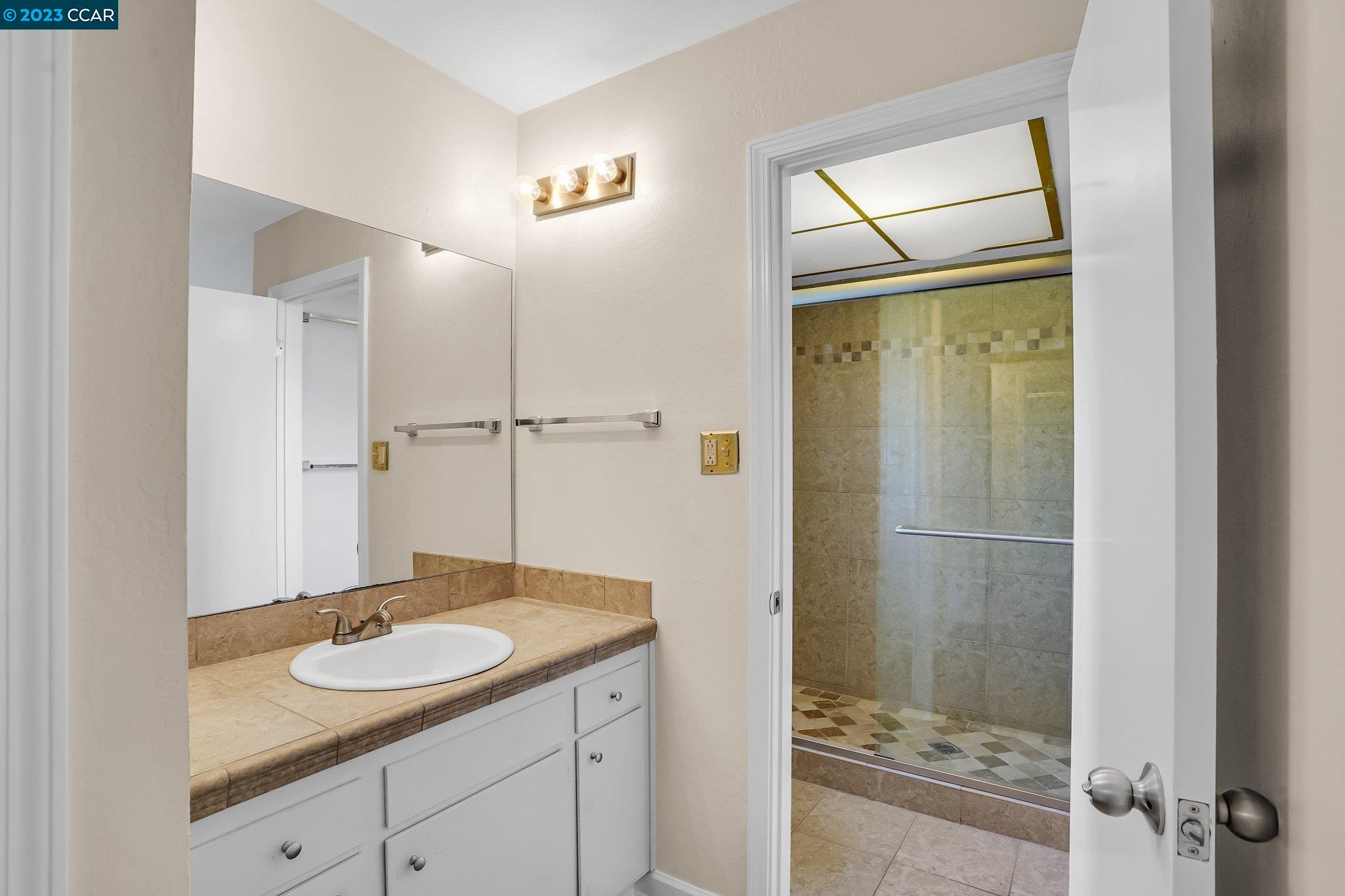 348 Barrett Circle Danville, CA 94526 - Photo 27 of 41 a bathroom with a sink and a mirror