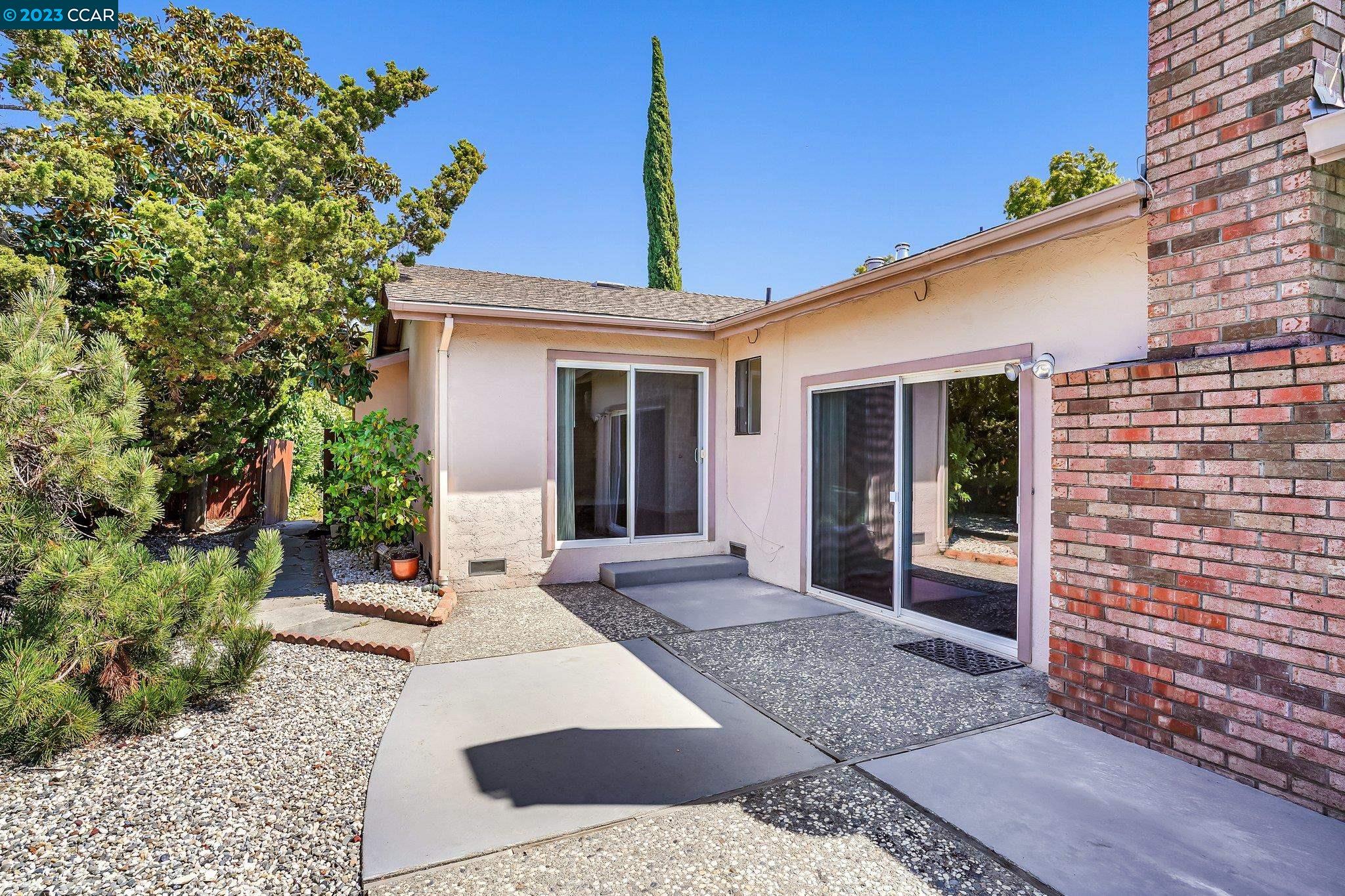 348 Barrett Circle Danville, CA 94526 - Photo 33 of 41 a front view of a house with a garden