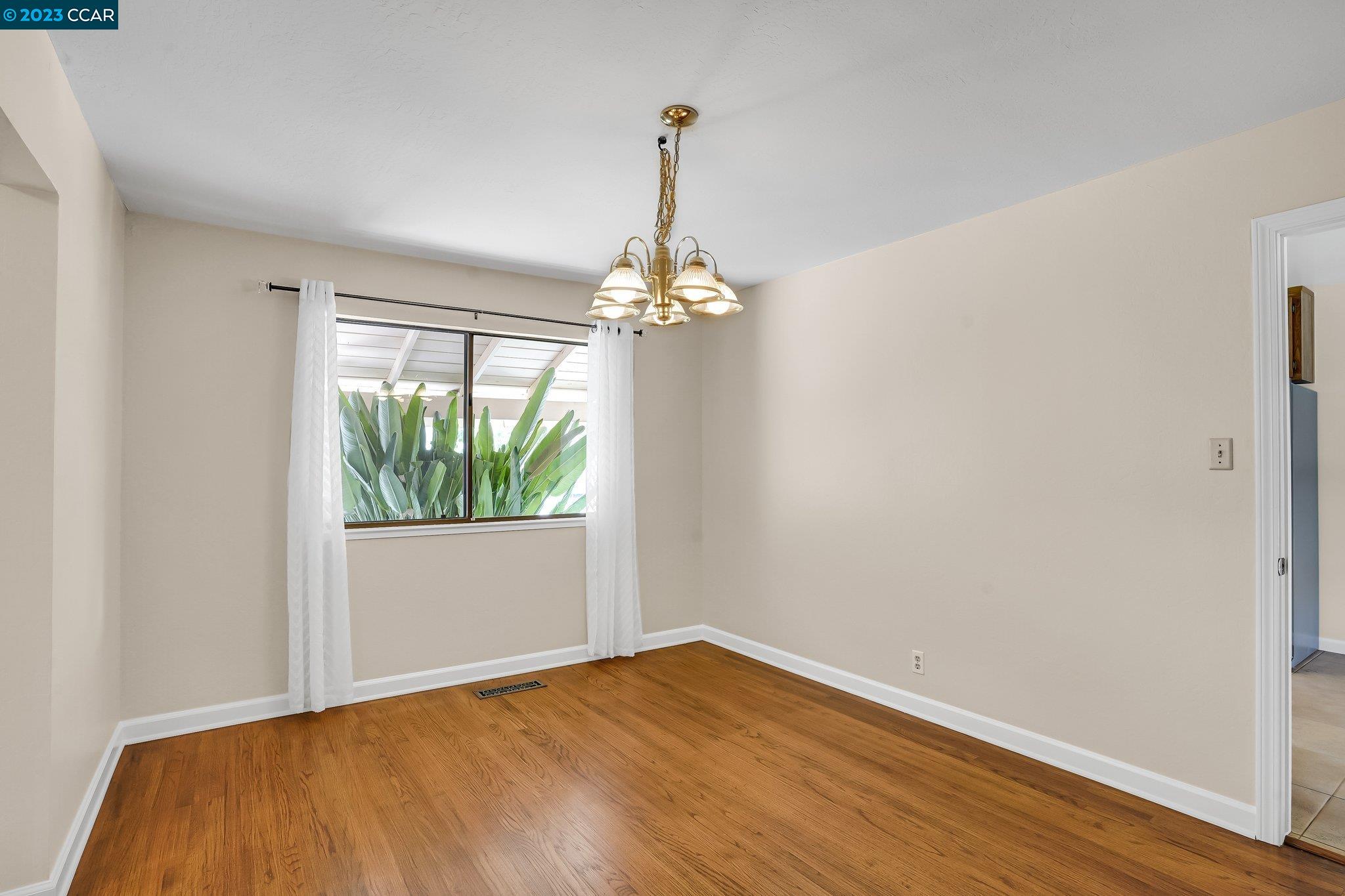 348 Barrett Circle Danville, CA 94526 - Photo 5 of 41 a very nice looking room with a large window and wooden floor