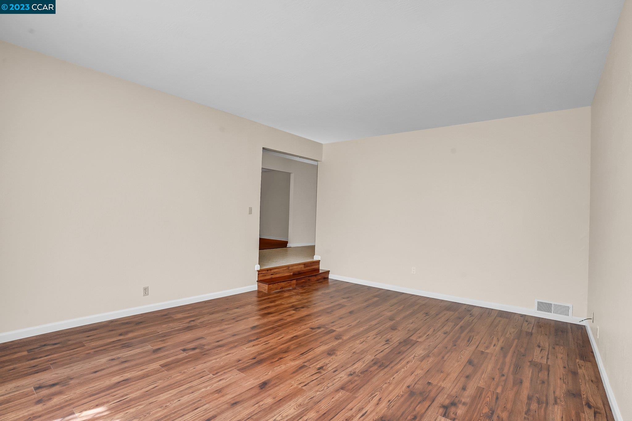 348 Barrett Circle Danville, CA 94526 - Photo 8 of 41 a view of an empty room with wooden floor