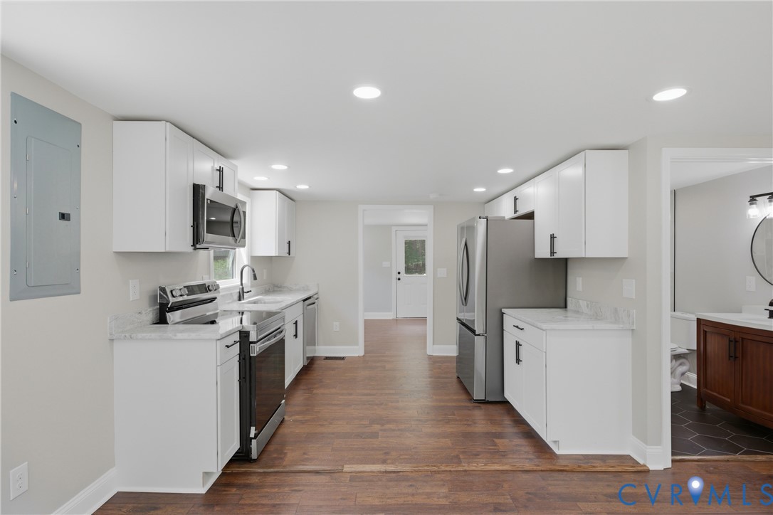 3497 Bumpass Road Beaverdam, VA 23015 - Photo 5 of 28 Kitchen featuring white cabinetry, stainless steel