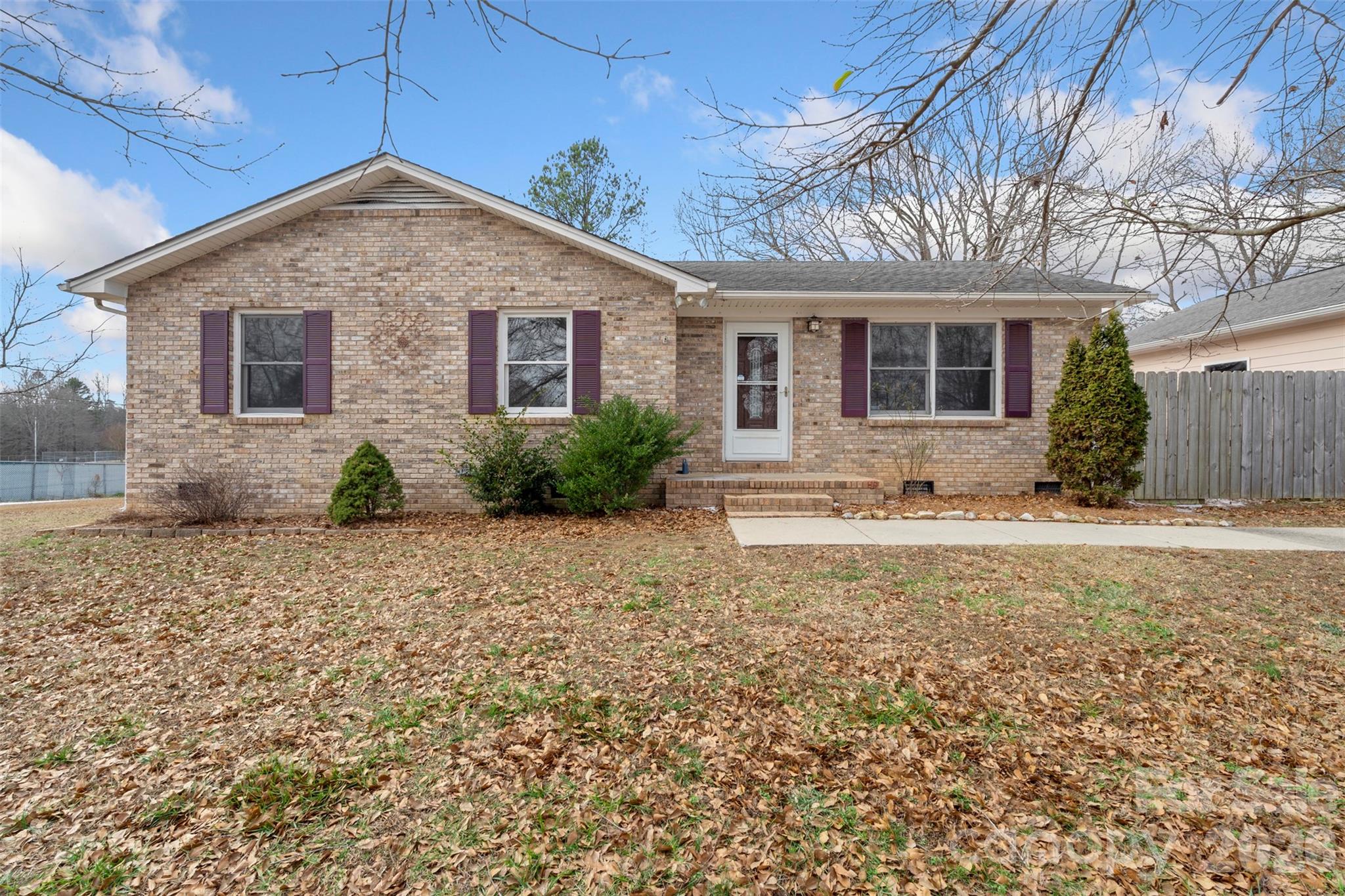 225 Belhaven Circle Clover, SC 29710 - Photo 1 of 29 a front view of a house with a yard and potted plants