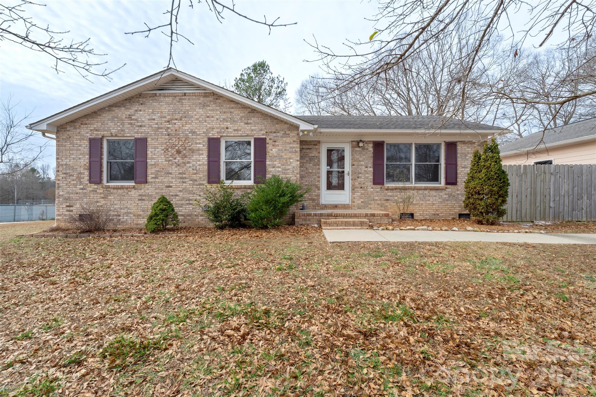 225 Belhaven Circle Clover, SC 29710 - Photo 2 of 29 a front view of house with yard and trees around