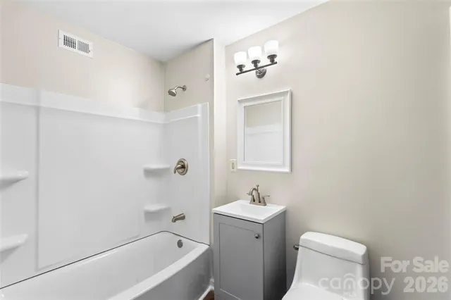 a bathroom with a sink toilet and bathtub