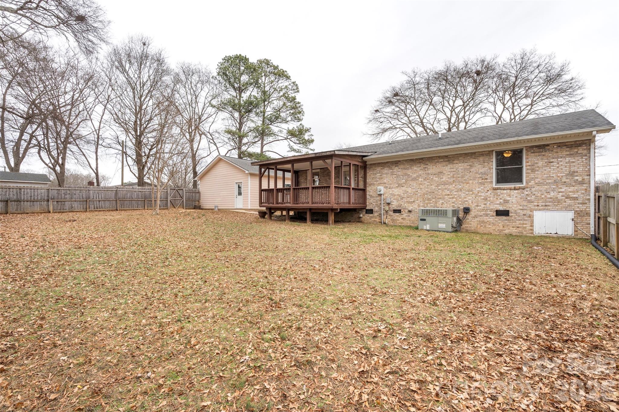 225 Belhaven Circle Clover, SC 29710 - Photo 29 of 29 a backyard of a house with table and chairs
