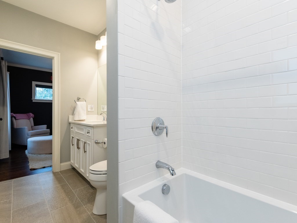 1708 Great Plain Avenue Needham, MA 02492 - Photo 16 of 34 a bathroom with a bathtub sink and toilet