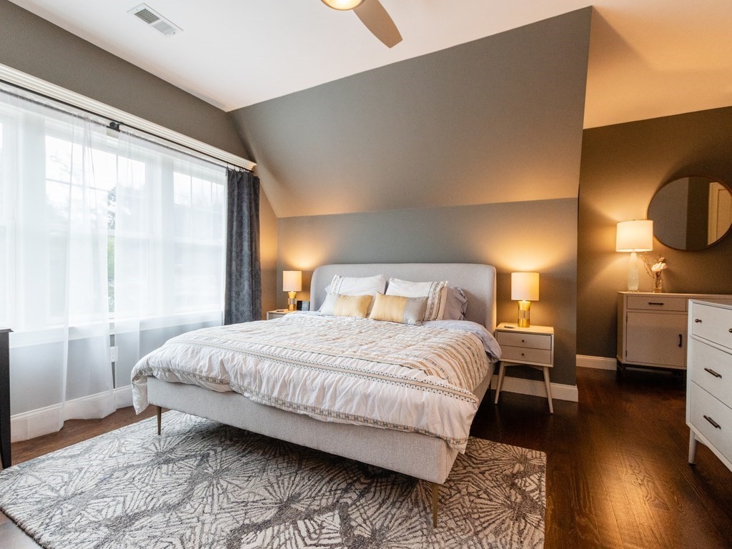 1708 Great Plain Avenue Needham, MA 02492 - Photo 17 of 34 a bedroom with a bed and wooden floor