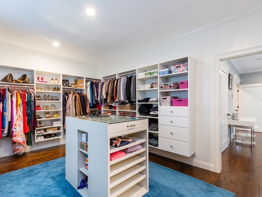 1708 Great Plain Avenue Needham, MA 02492 - Photo 19 of 34 a view of walk in closet with clothes and shoes