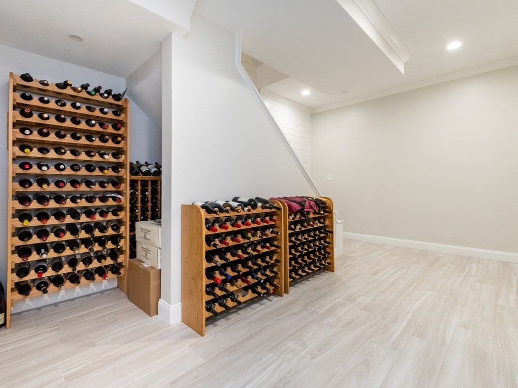 1708 Great Plain Avenue Needham, MA 02492 - Photo 24 of 34 a room with black white checkered floor and a large window