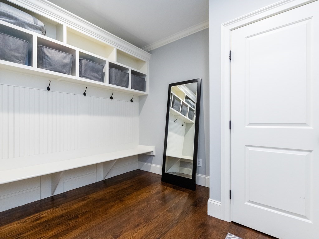 1708 Great Plain Avenue Needham, MA 02492 - Photo 4 of 34 a view of an empty room with wooden floor and a window