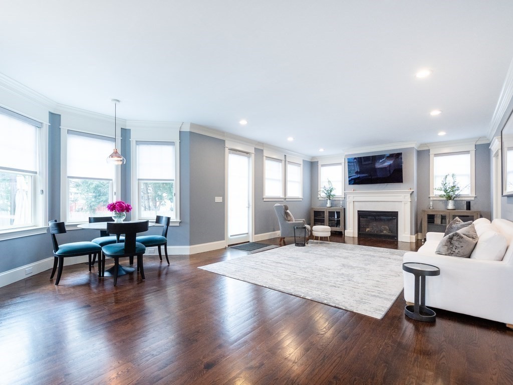1708 Great Plain Avenue Needham, MA 02492 - Photo 10 of 34 a living room with furniture a fireplace and a large window