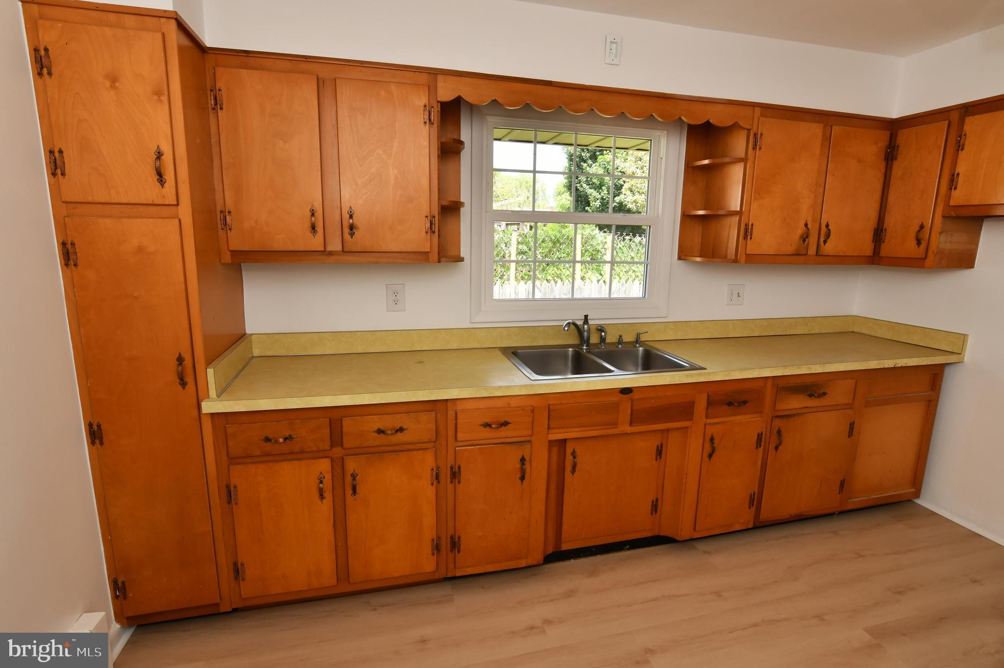 437 Beechcroft Road Winchester, VA 22601 - Photo 18 of 52 a kitchen with stainless steel appliances granite countertop wooden cabinets a sink and a window