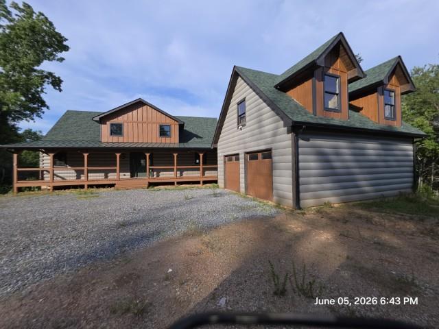 95 Ridgeline Lane Mineral Bluff, GA 30559 - Photo 1 of 73 a front view of a house with a yard and garage