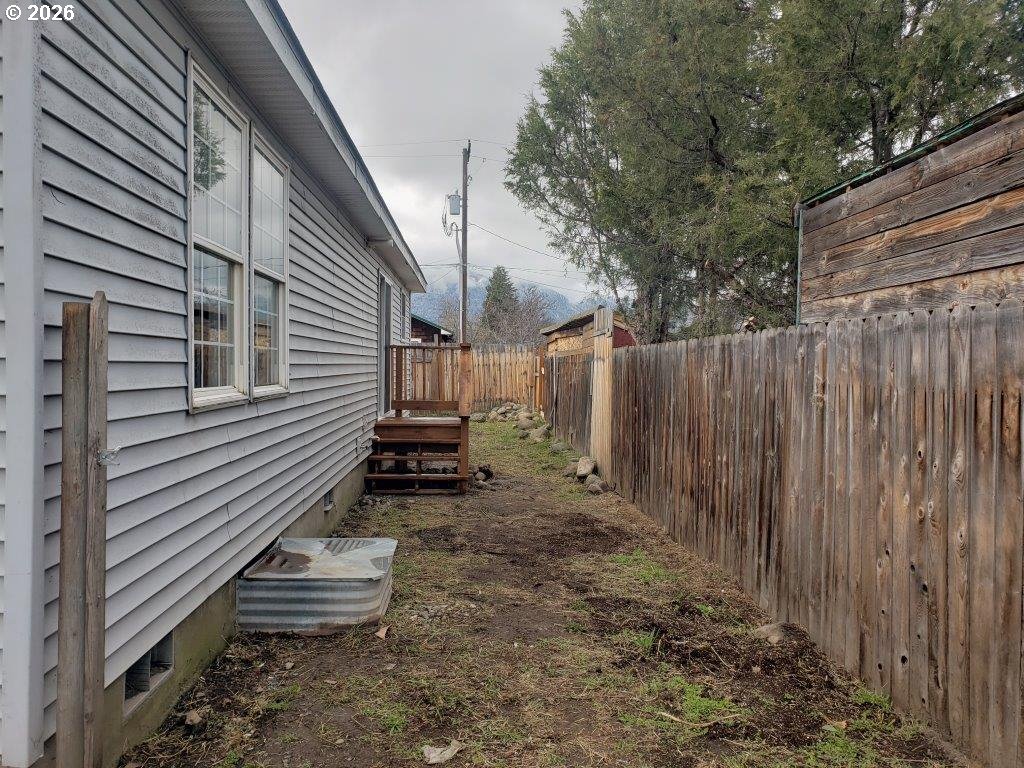 907 South College Street Joseph, OR 97846 - Photo 2 of 25 a view of a house with backyard and wooden fence