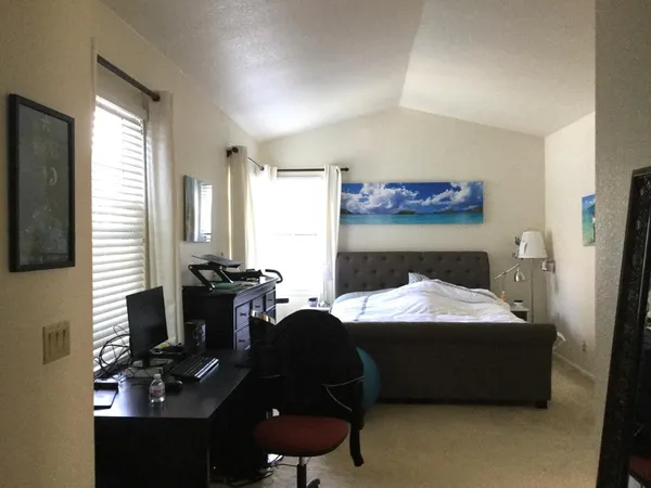 a room with furniture and a flat screen tv