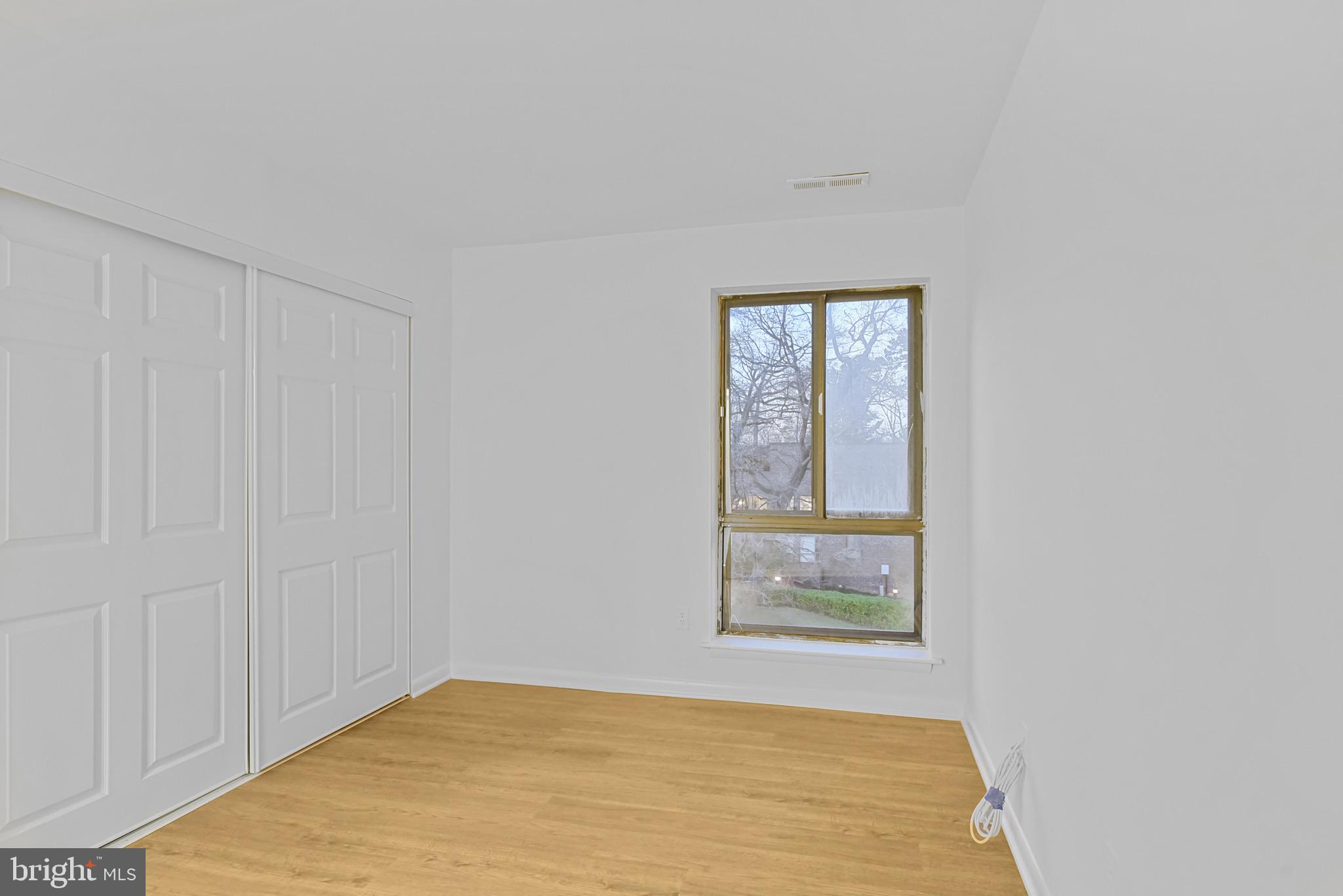 11212 Chestnut Grove Square, Unit 313 Reston, VA 20190 - Photo 11 of 22 a view of an empty room and window