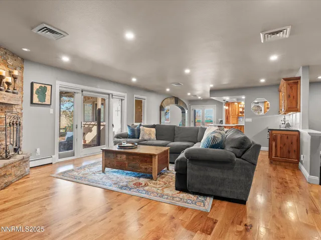 a view of a dining room with furniture and chandelier