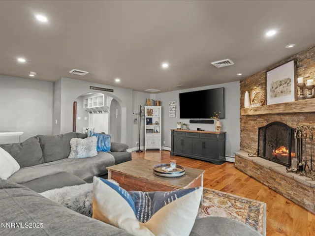 a spacious bedroom with a bed and couch