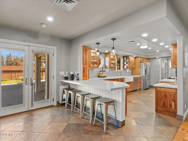 a spacious bathroom with a double vanity sink and a mirror