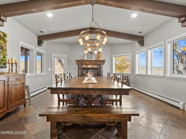 a workspace with furniture window and wooden floor