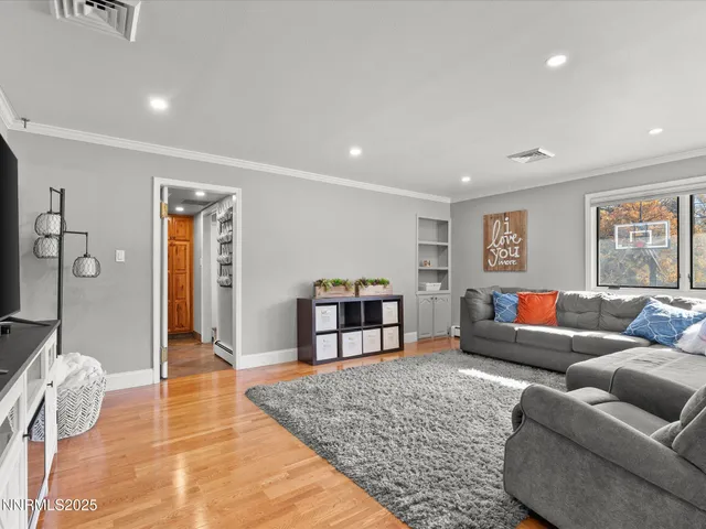 a en suite bathroom with a double vanity sink and a mirror