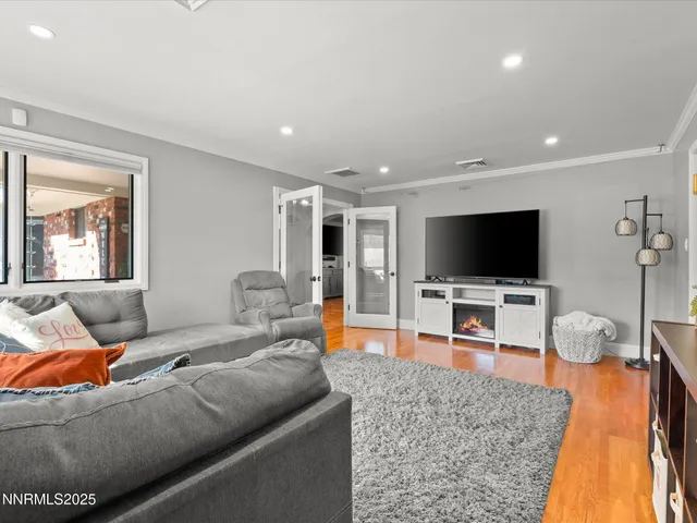 a bedroom with a large bed and a large window