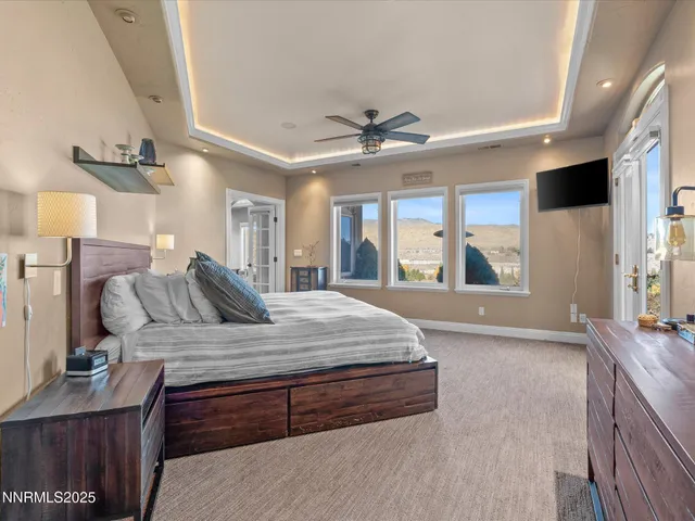 a room with wooden floor and pool table